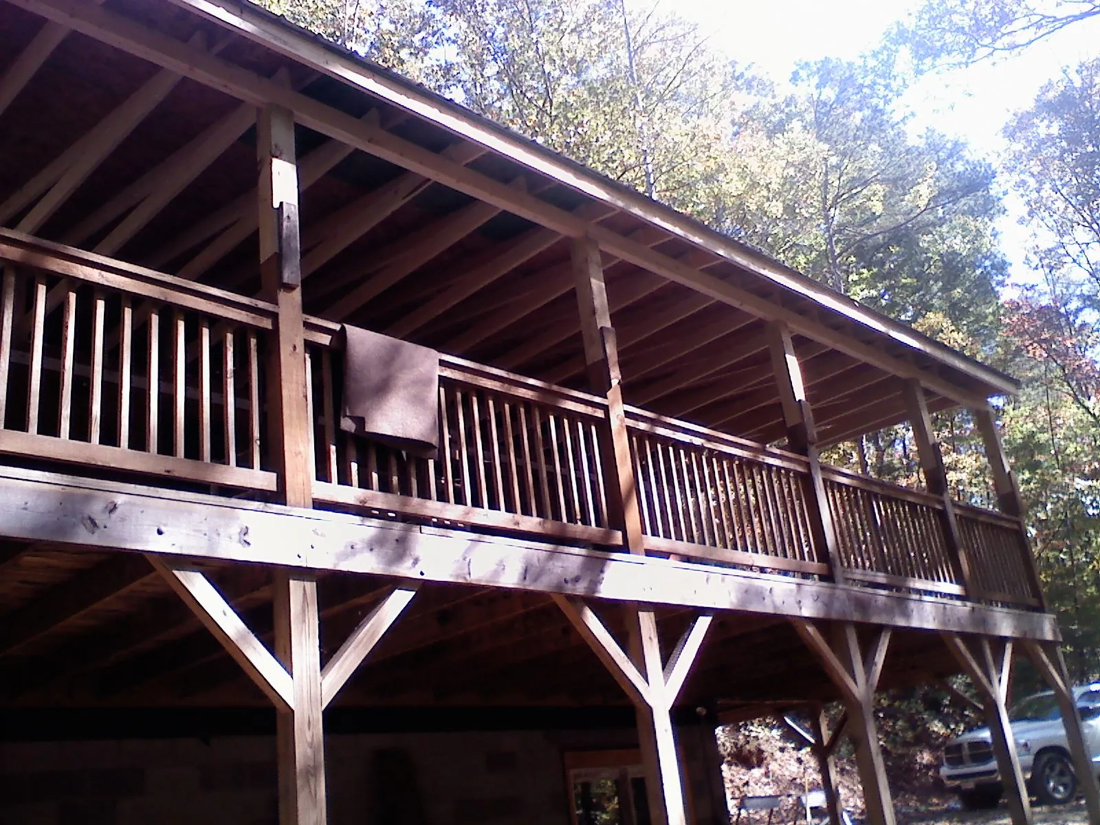 Timber framing under a new elevated porch and deck — Roof Leak Repair in Waterboro by Roofing Brothers